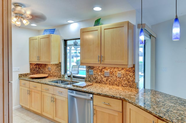8402 13th Ave NW, Bradenton, FL 34209 - kitchen with stainless steel dishwasher, light brown cabinetry, ceiling fan, and decorative backsplash