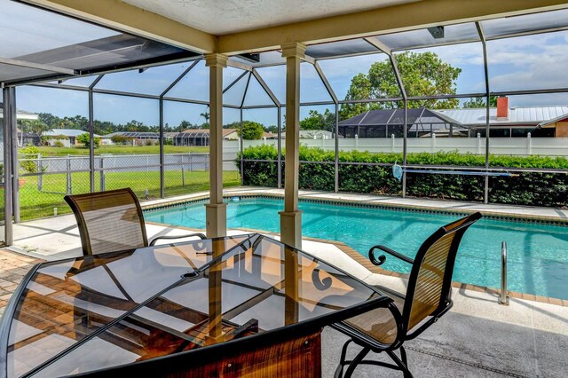 8402 13th Ave NW, Bradenton, FL 34209 - view of pool featuring a residential view, a patio area, and glass enclosure
