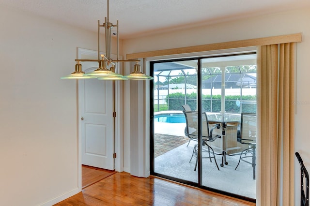 8402 13th Ave NW, Bradenton, FL 34209 - dining area featuring wood finished floors and baseboards