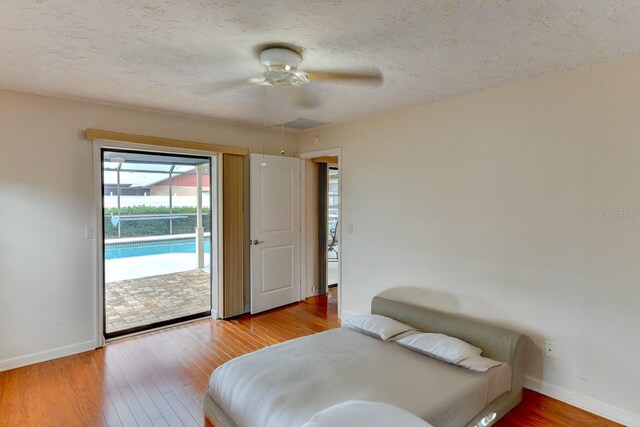 8402 13th Ave NW, Bradenton, FL 34209 - bedroom with access to outside, baseboards, wood finished floors, and ceiling fan