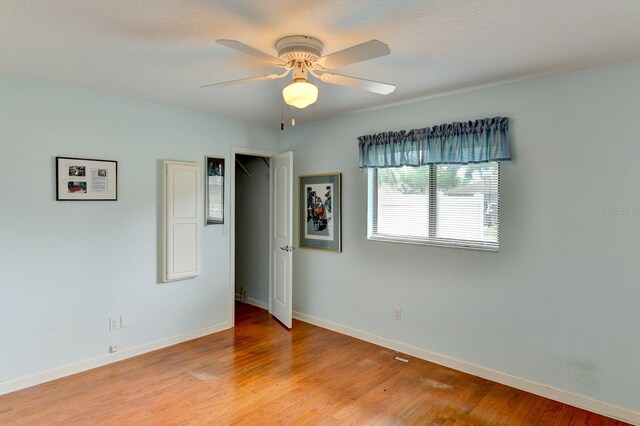8402 13th Ave NW, Bradenton, FL 34209 - unfurnished bedroom featuring baseboards, light wood-style floors, and ceiling fan