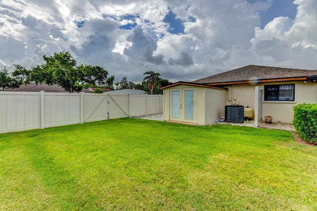 8402 13th Ave NW, Bradenton, FL 34209 - view of yard featuring a gate and central AC
