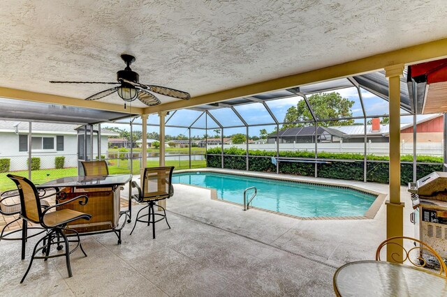 8402 13th Ave NW, Bradenton, FL 34209 - view of swimming pool with a patio, a lanai, and a ceiling fan
