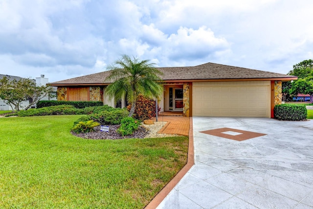 8402 13th Ave NW, Bradenton, FL 34209 - ranch-style house featuring driveway, a garage, a front yard, and stone siding