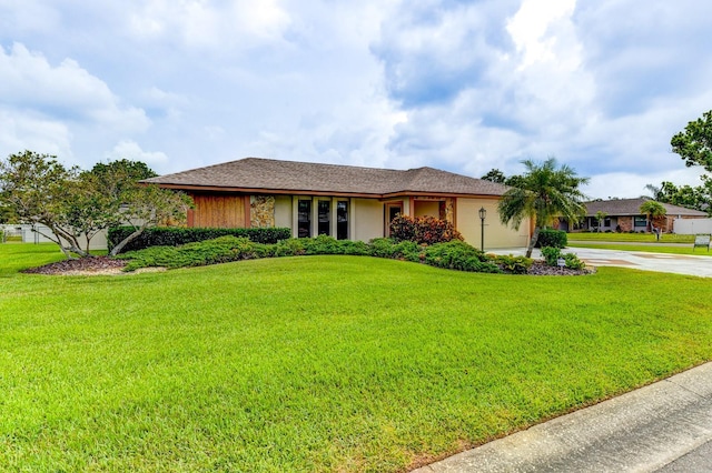 8402 13th Ave NW, Bradenton, FL 34209 - ranch-style home featuring driveway, a front yard, and a garage