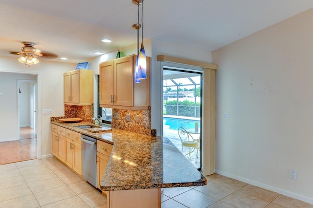 8402 13th Ave NW, Bradenton, FL 34209 - kitchen featuring dishwasher, a sink, tasteful backsplash, light tile patterned flooring, and a peninsula
