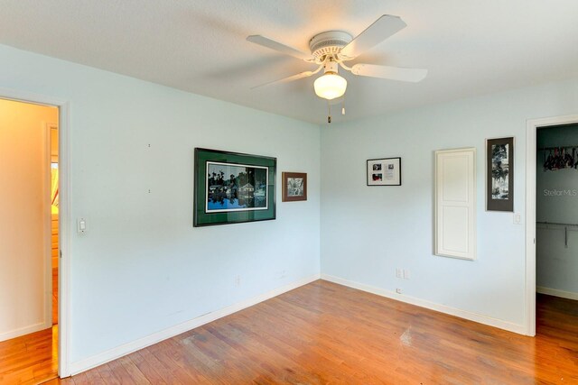 8402 13th Ave NW, Bradenton, FL 34209 - unfurnished room with a ceiling fan, wood finished floors, and baseboards