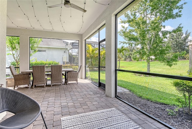 11502 Golden Bay Pl, Bradenton, FL 34211 - sunroom featuring ceiling fan and outdoor dining space