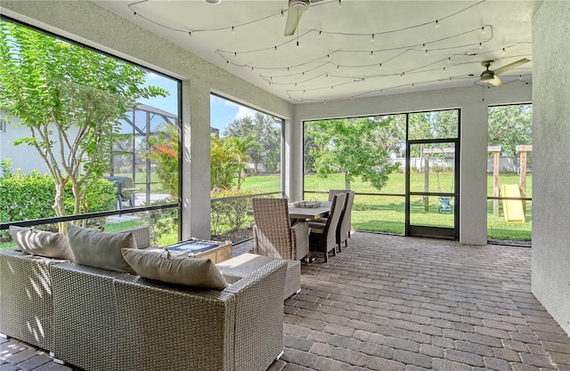 11502 Golden Bay Pl, Bradenton, FL 34211 - sunroom featuring ceiling fan and outdoor dining space