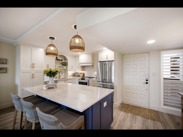 2045 Gulf Of Mexico Dr Unit M1-505, Longboat Key, FL 34228 - kitchen with premium appliances, open shelves, white cabinetry, baseboards, and recessed lighting