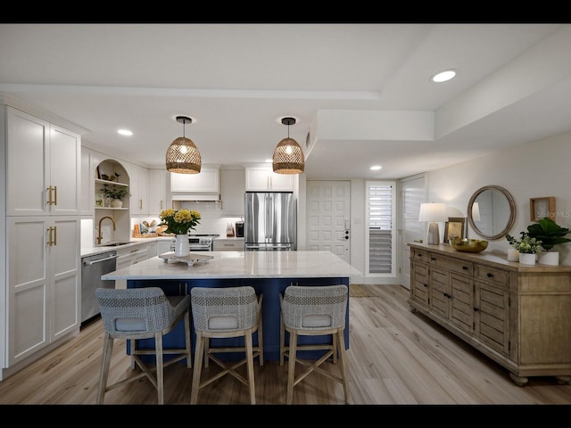 2045 Gulf Of Mexico Dr Unit M1-505, Longboat Key, FL 34228 - kitchen with stainless steel appliances, a sink, open shelves, white cabinets, and recessed lighting
