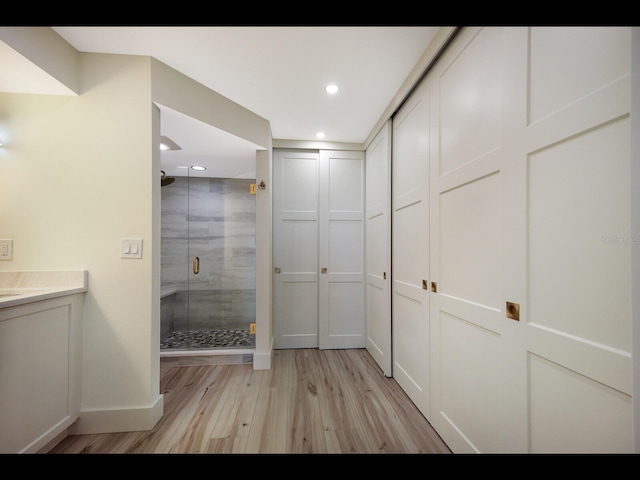 2045 Gulf Of Mexico Dr Unit M1-505, Longboat Key, FL 34228 - corridor with light wood finished floors, baseboards, and recessed lighting