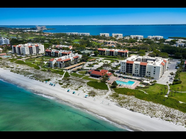 2045 Gulf Of Mexico Dr Unit M1-505, Longboat Key, FL 34228 - bird's eye view of unending shoreline, apartment complex, and a pool area