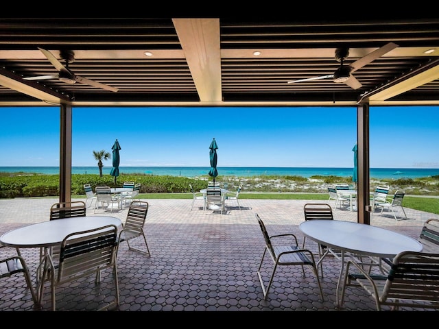 2045 Gulf Of Mexico Dr Unit M1-505, Longboat Key, FL 34228 - view of patio / terrace featuring outdoor dining area, a water view, and ceiling fan