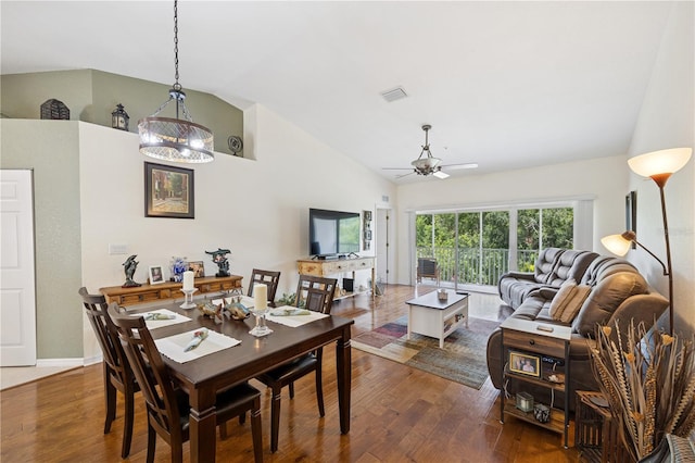 7532 Marsh Orchid Cir Unit 8-201, Bradenton, FL 34203 - dining area with ceiling fan, wood finished floors, and high vaulted ceiling
