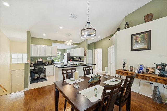 7532 Marsh Orchid Cir Unit 8-201, Bradenton, FL 34203 - dining room featuring hardwood / wood-style flooring, ceiling fan, recessed lighting, a chandelier, and lofted ceiling