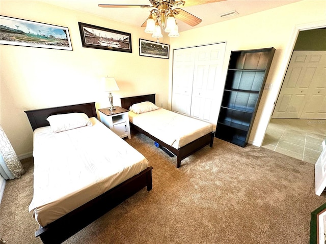 7532 Marsh Orchid Cir Unit 8-201, Bradenton, FL 34203 - bedroom featuring carpet, a closet, a ceiling fan, and baseboards