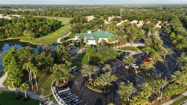 7532 Marsh Orchid Cir Unit 8-201, Bradenton, FL 34203 - bird's eye view of a nearby body of water and a golf club
