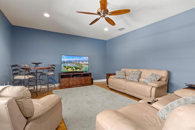 5373 Anthony Ln, Sarasota, FL 34233 - living area featuring ceiling fan, wood finished floors, recessed lighting, and baseboards