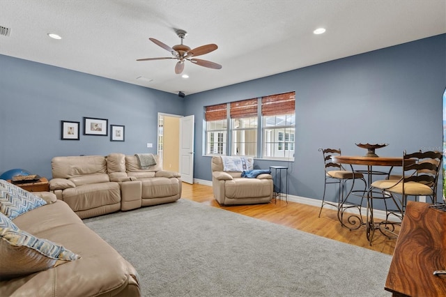 5373 Anthony Ln, Sarasota, FL 34233 - living area with a ceiling fan, wood finished floors, baseboards, and recessed lighting
