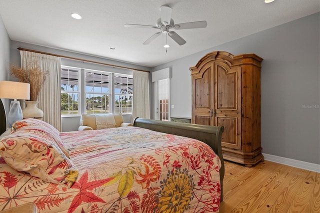 5373 Anthony Ln, Sarasota, FL 34233 - bedroom with light wood-type flooring, baseboards, a ceiling fan, and recessed lighting