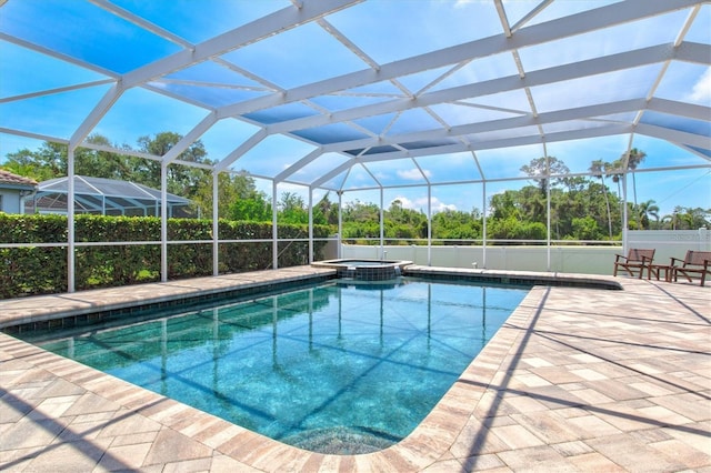 5373 Anthony Ln, Sarasota, FL 34233 - view of pool with a pool with connected hot tub, a patio area, and glass enclosure
