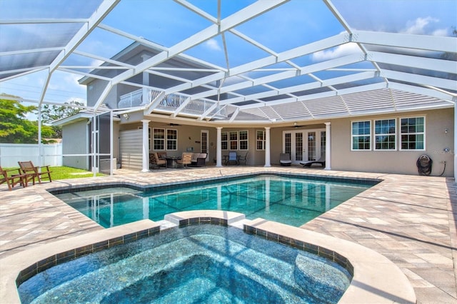 5373 Anthony Ln, Sarasota, FL 34233 - view of pool with ceiling fan, a pool with connected hot tub, french doors, a patio area, and glass enclosure