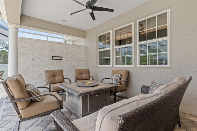 5373 Anthony Ln, Sarasota, FL 34233 - view of patio featuring a ceiling fan and an outdoor living space with a fire pit