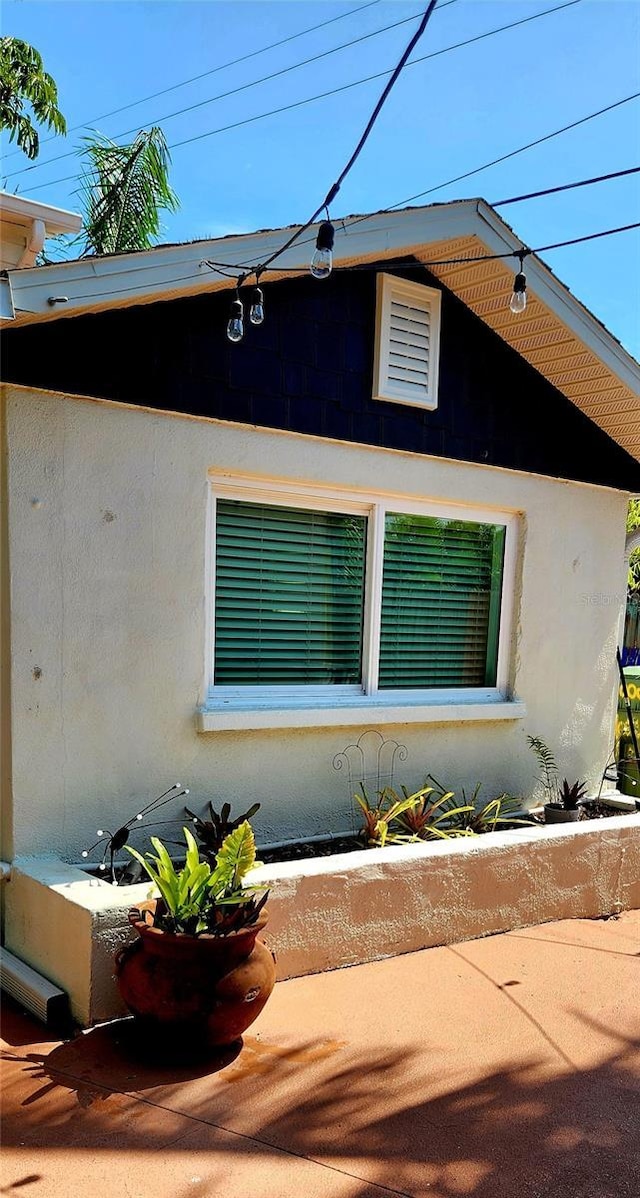 219 24th St W, Bradenton, FL 34205 - view of property exterior featuring stucco siding