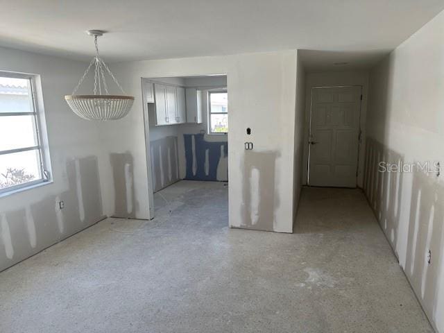 669 Spanish Dr N Unit 21, Longboat Key, FL 34228 - unfurnished dining area featuring a chandelier