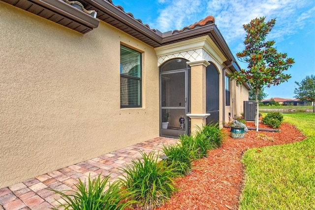 12230 Amica Loop, Venice, FL 34293 - view of exterior entry featuring stucco siding
