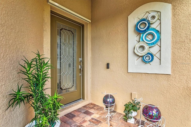12230 Amica Loop, Venice, FL 34293 - view of exterior entry featuring stucco siding