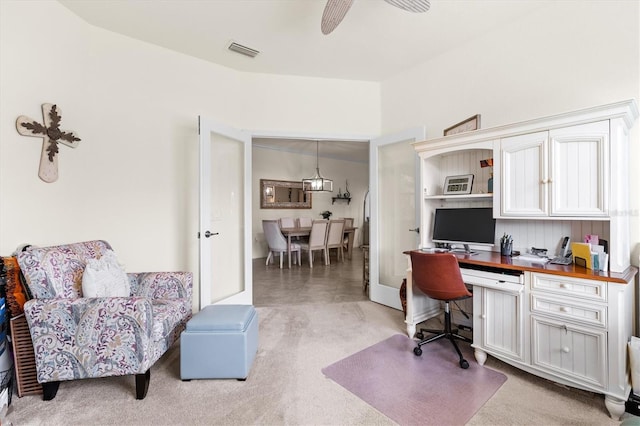 12230 Amica Loop, Venice, FL 34293 - home office featuring a ceiling fan, light colored carpet, and built in desk