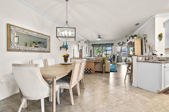 12230 Amica Loop, Venice, FL 34293 - dining area featuring ornamental molding, a chandelier, a ceiling fan, light tile patterned floors, and baseboards