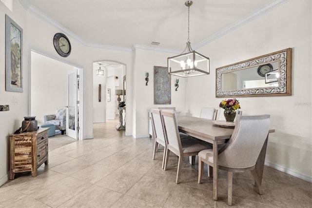 12230 Amica Loop, Venice, FL 34293 - dining space featuring ornamental molding, arched walkways, baseboards, and a chandelier