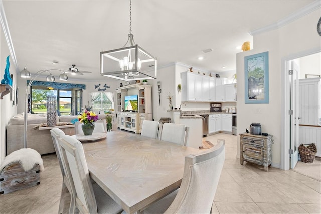 12230 Amica Loop, Venice, FL 34293 - dining area featuring crown molding, a chandelier, light tile patterned flooring, and recessed lighting
