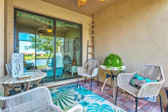 12230 Amica Loop, Venice, FL 34293 - view of patio with a water view and a ceiling fan