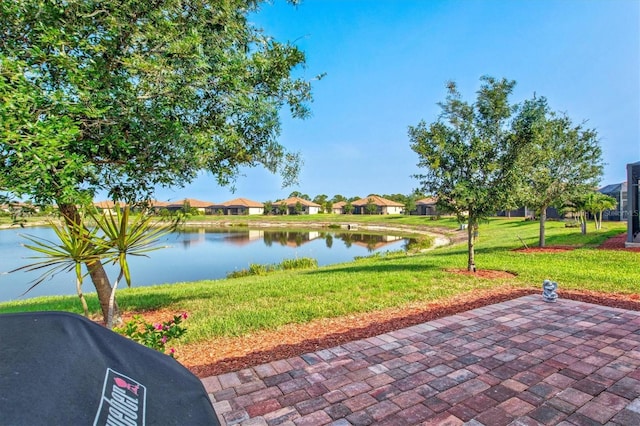 12230 Amica Loop, Venice, FL 34293 - view of patio / terrace with a water view and a residential view