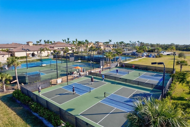 12230 Amica Loop, Venice, FL 34293 - view of tennis court with a residential view