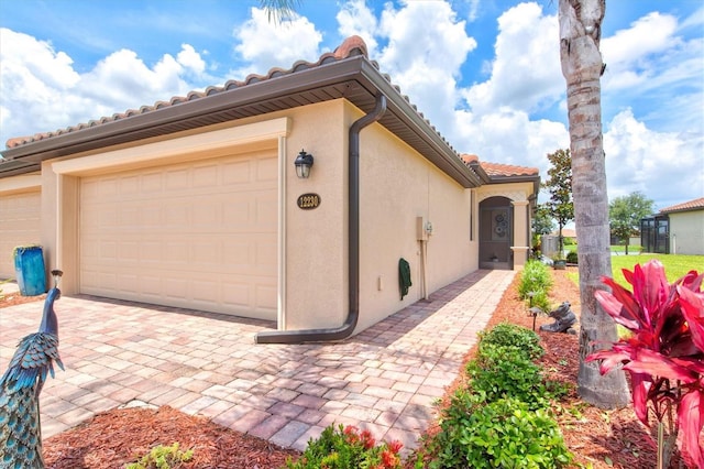 12230 Amica Loop, Venice, FL 34293 - garage with driveway