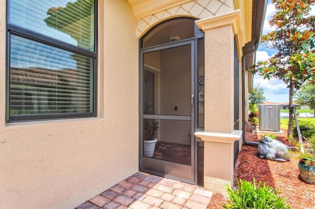 12230 Amica Loop, Venice, FL 34293 - property entrance featuring stucco siding