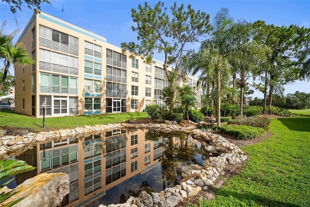 4530 Pinebrook Cir Unit 109, Bradenton, FL 34209 - view of property with a garden pond