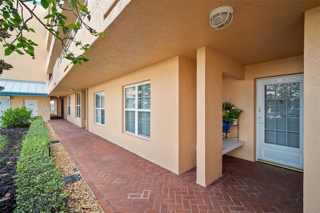 4530 Pinebrook Cir Unit 109, Bradenton, FL 34209 - view of home's exterior with stucco siding and a patio