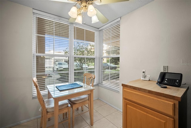 4530 Pinebrook Cir Unit 109, Bradenton, FL 34209 - dining room featuring a desk, ceiling fan, light tile patterned floors, and baseboards