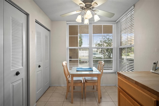 4530 Pinebrook Cir Unit 109, Bradenton, FL 34209 - dining space featuring light tile patterned flooring, a ceiling fan, and baseboards