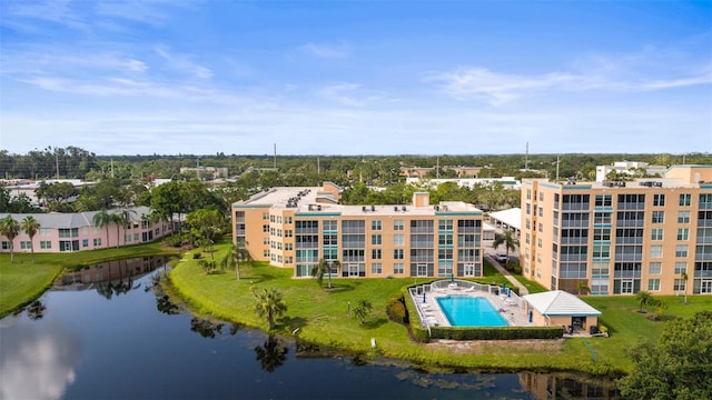 4530 Pinebrook Cir Unit 109, Bradenton, FL 34209 - drone / aerial view of a pool area, apartment complex / building, and a large body of water