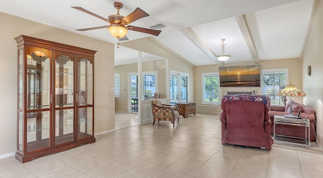 4308 Kingston Loop, Sarasota, FL 34238 - living area with a tiled fireplace, ceiling fan, baseboards, and light tile patterned floors