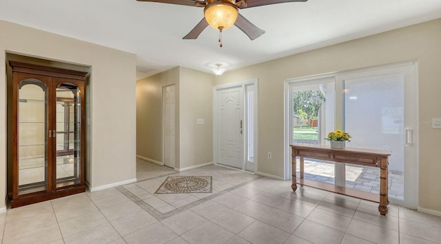 4308 Kingston Loop, Sarasota, FL 34238 - entrance foyer with ceiling fan, baseboards, and light tile patterned floors