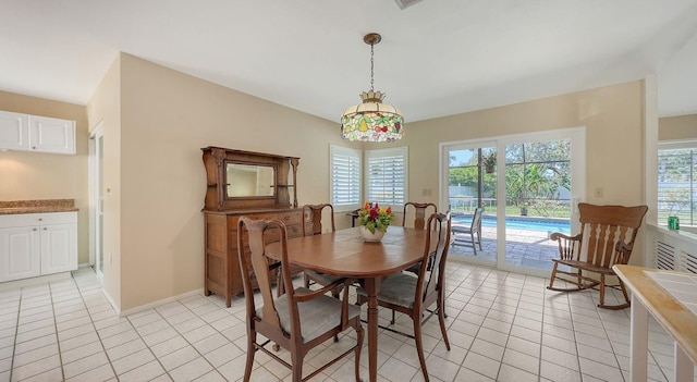 4308 Kingston Loop, Sarasota, FL 34238 - dining room with light tile patterned flooring and baseboards