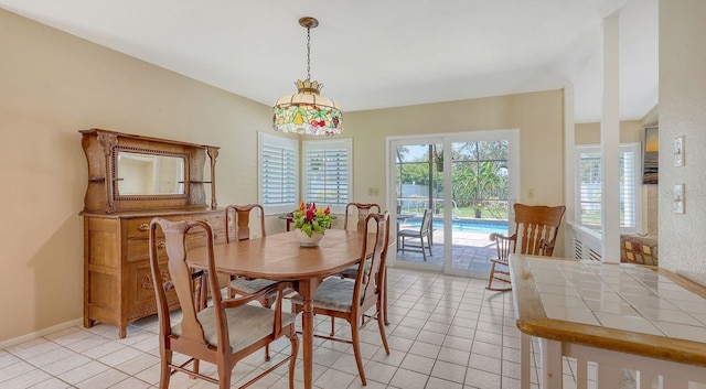 4308 Kingston Loop, Sarasota, FL 34238 - dining area with light tile patterned floors and baseboards